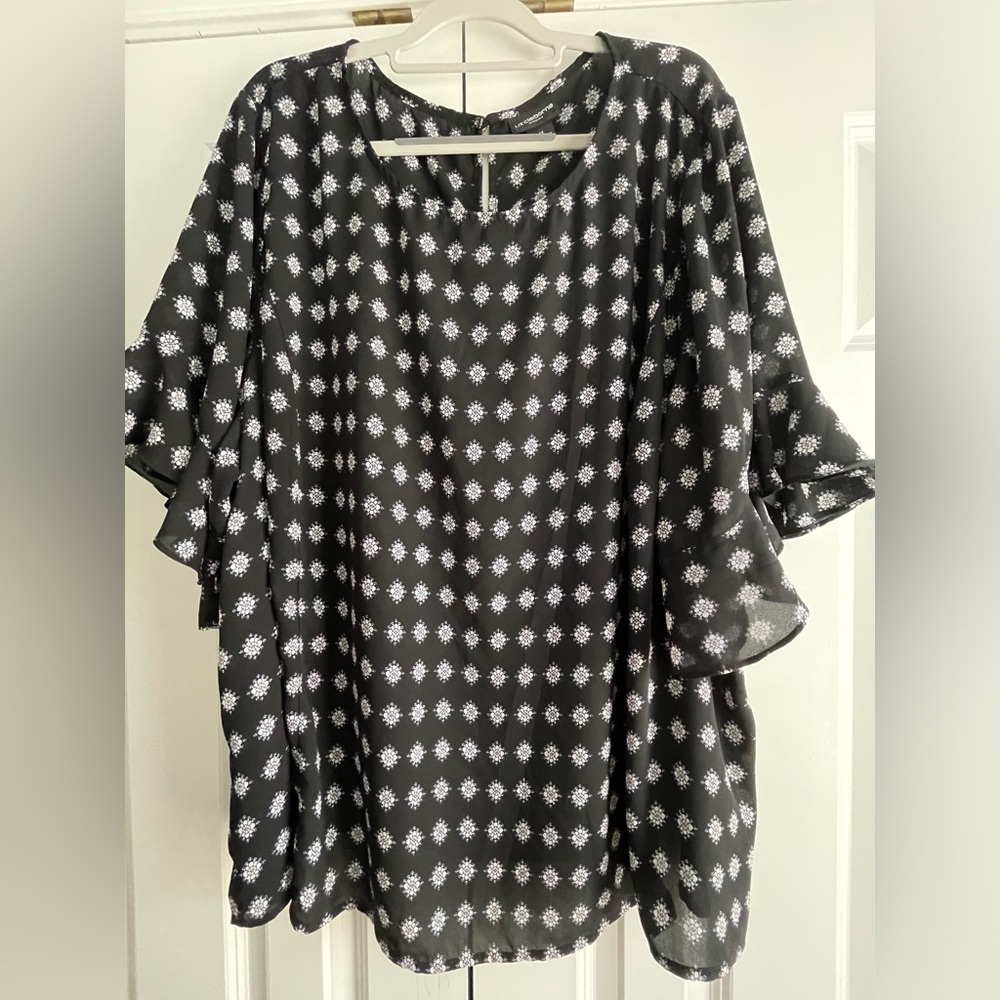 Black top with white decor